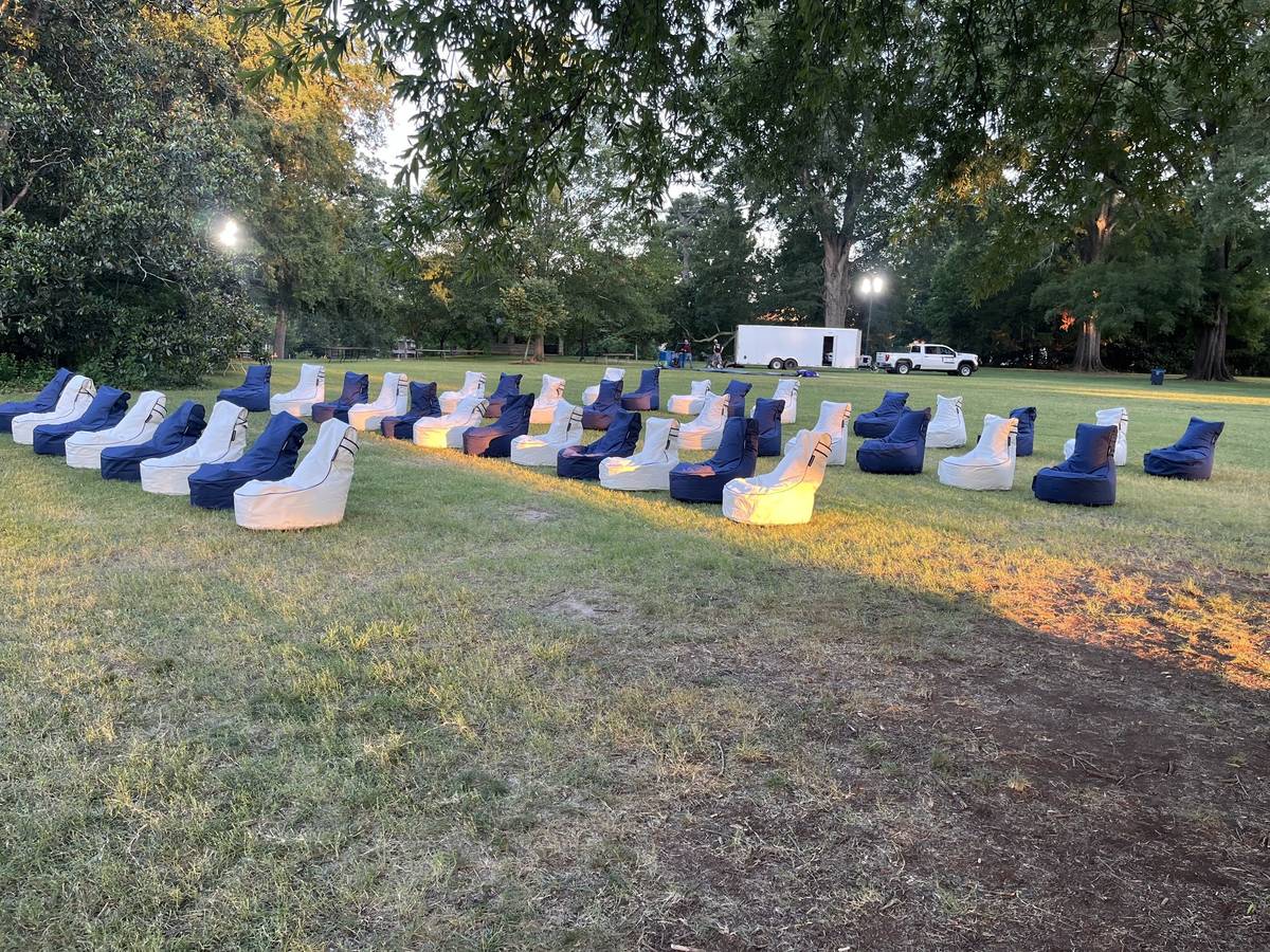 Rows of bean bag chairs being laid out beside the delivery truck