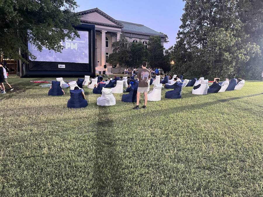 Students relaxing on bean bag chairs at a campus event